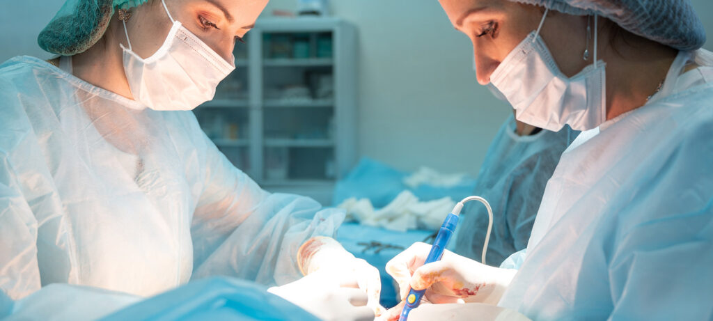 two female surgeons performing surgery