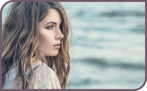 Woman with reshaped nose after rhinoplasty