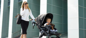 Image of a mom walking her baby in a stroller.