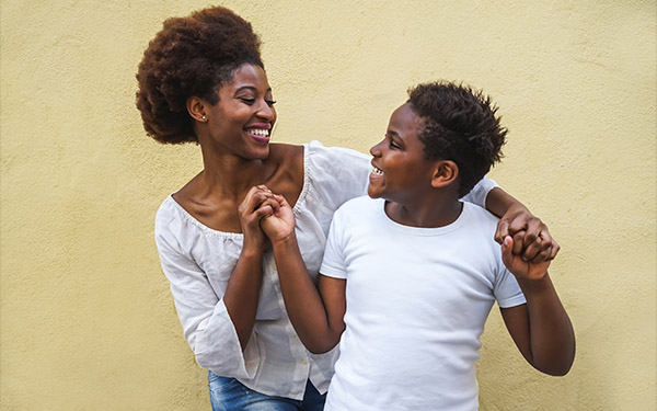 Image of a mom dancing with her son.