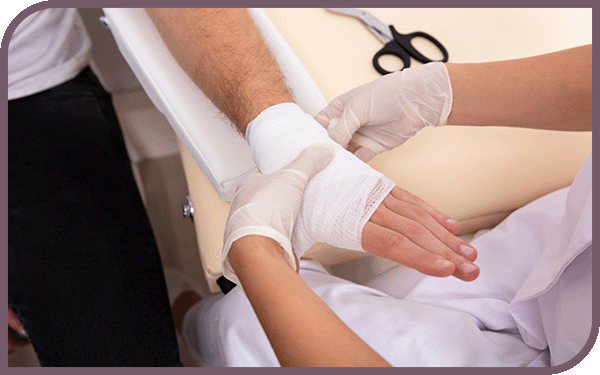 doctor wrapping a hand
