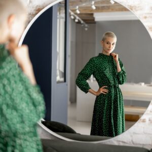 woman looking at results in mirror