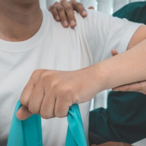 a person clenching an elastic band