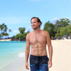 man walking on the beach happy