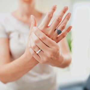 Woman grabbing her hand. 