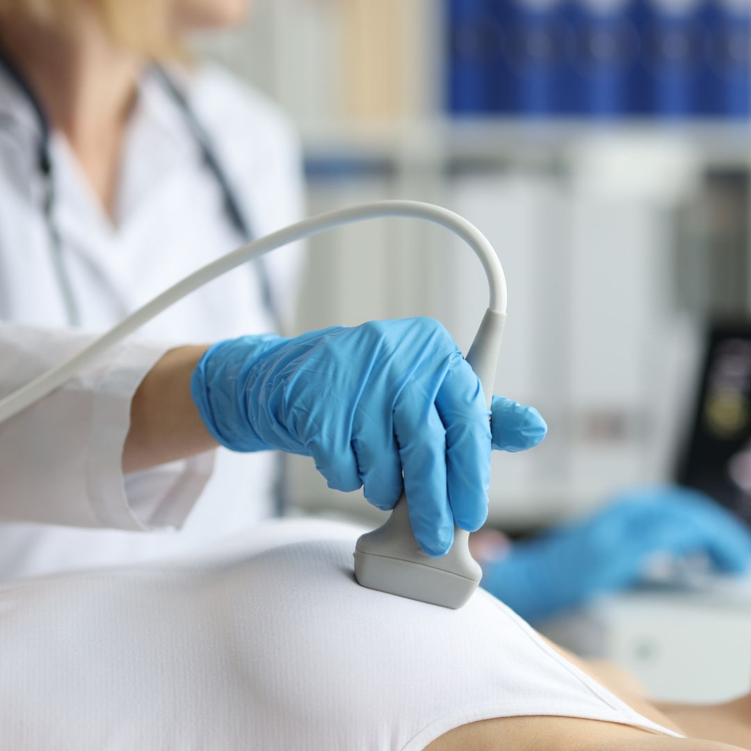 Doctor examining a women's breast