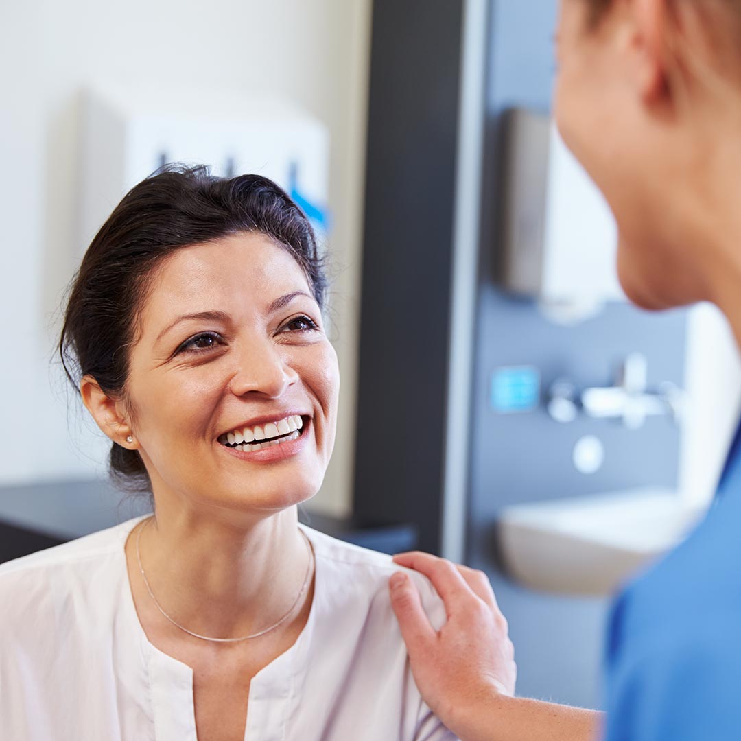 smiling woman at the doctor's office
