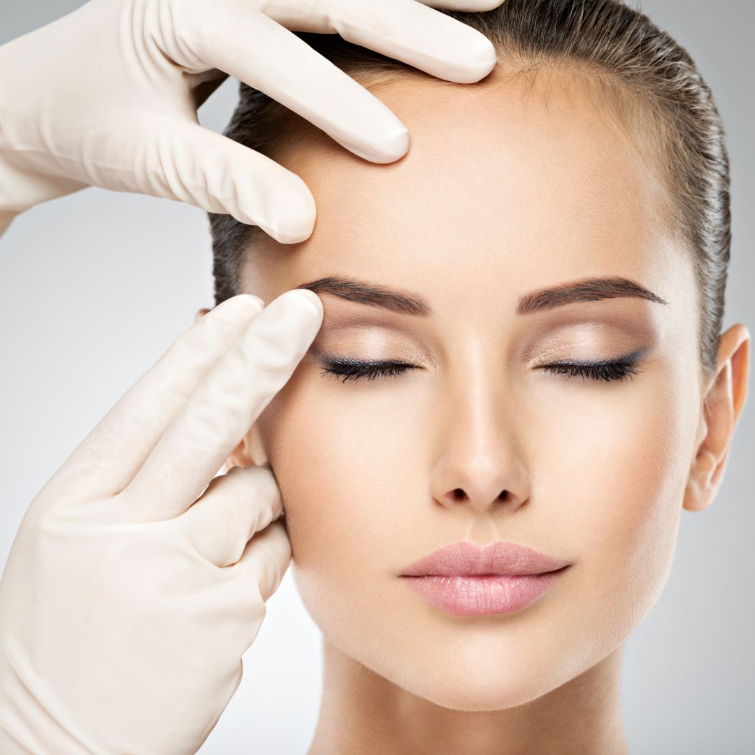 a woman having her face examined