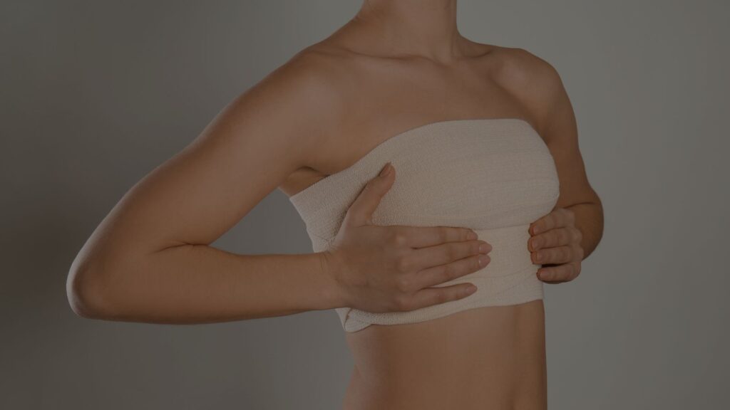 a woman holding her breasts