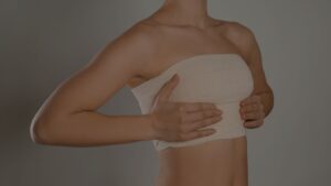 a woman holding her breasts