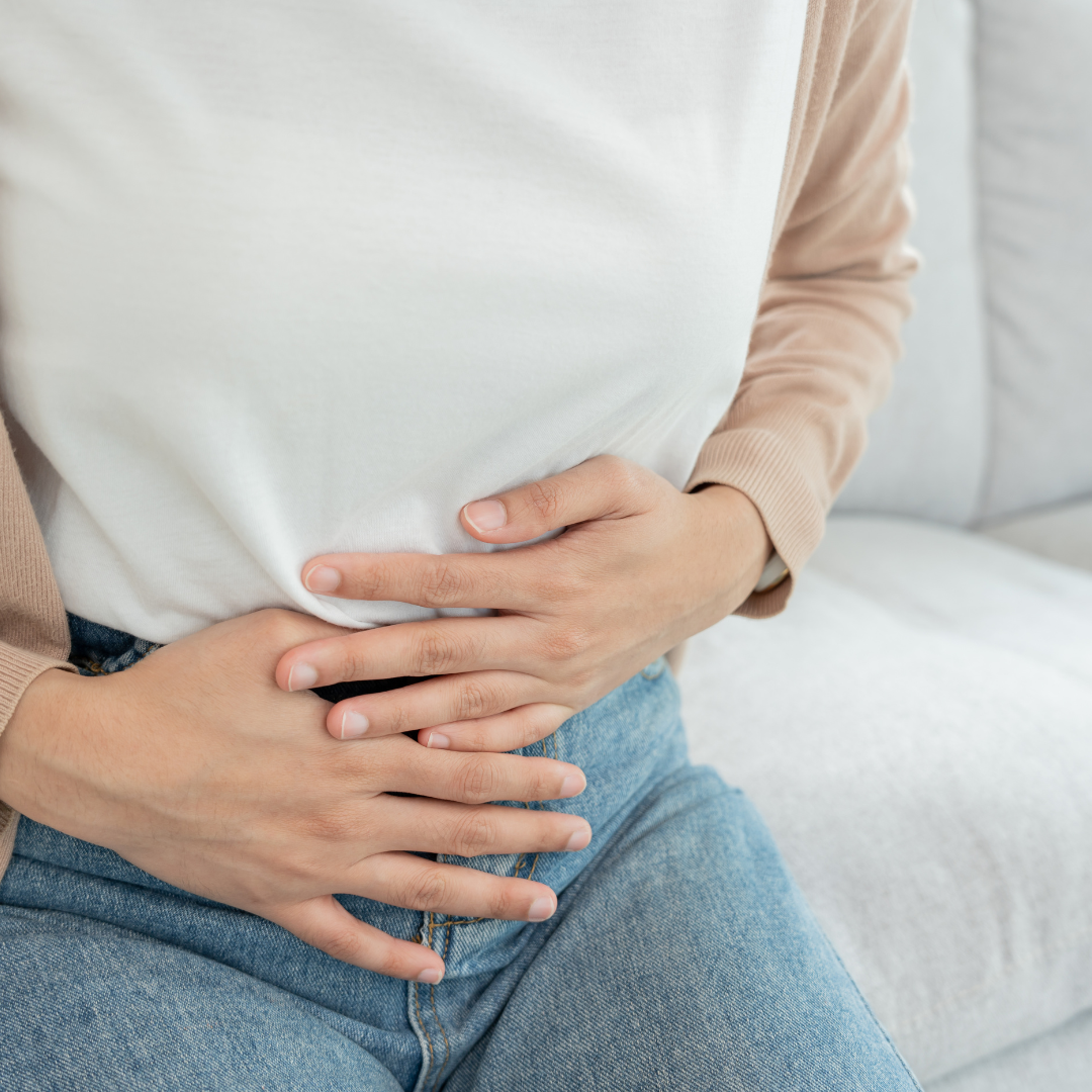 A woman holding her stomach 