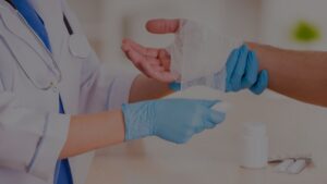 doctor wrapping patient's hand