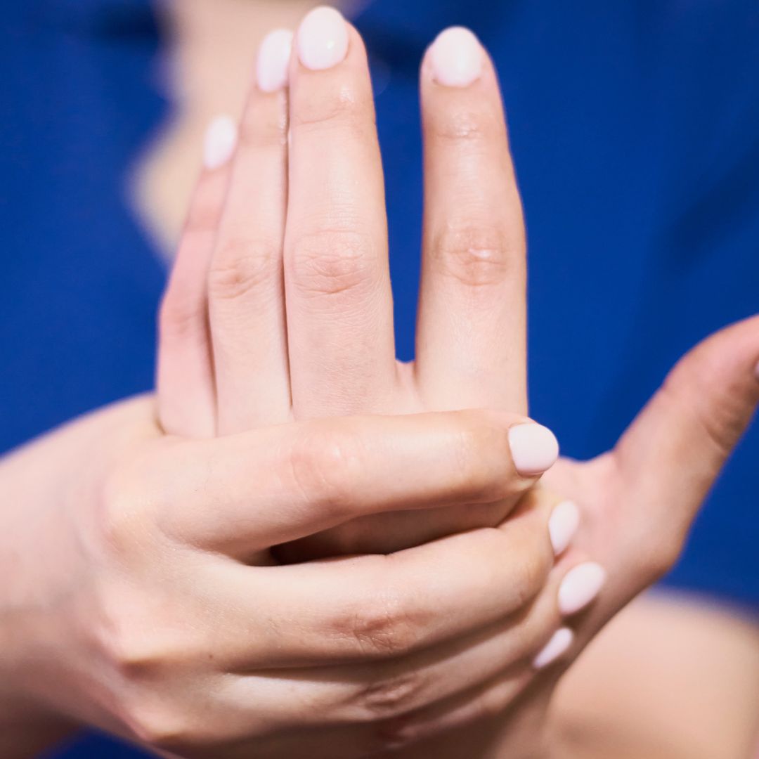 person stretching wrist