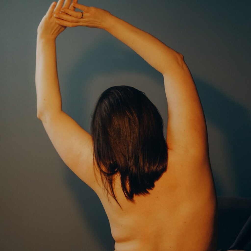 A woman after breast focused plastic surgery.