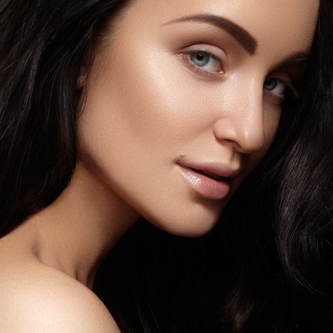 A happy woman after an eyebrow lift.