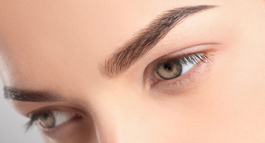 Closeup of an eyebrow lift results.